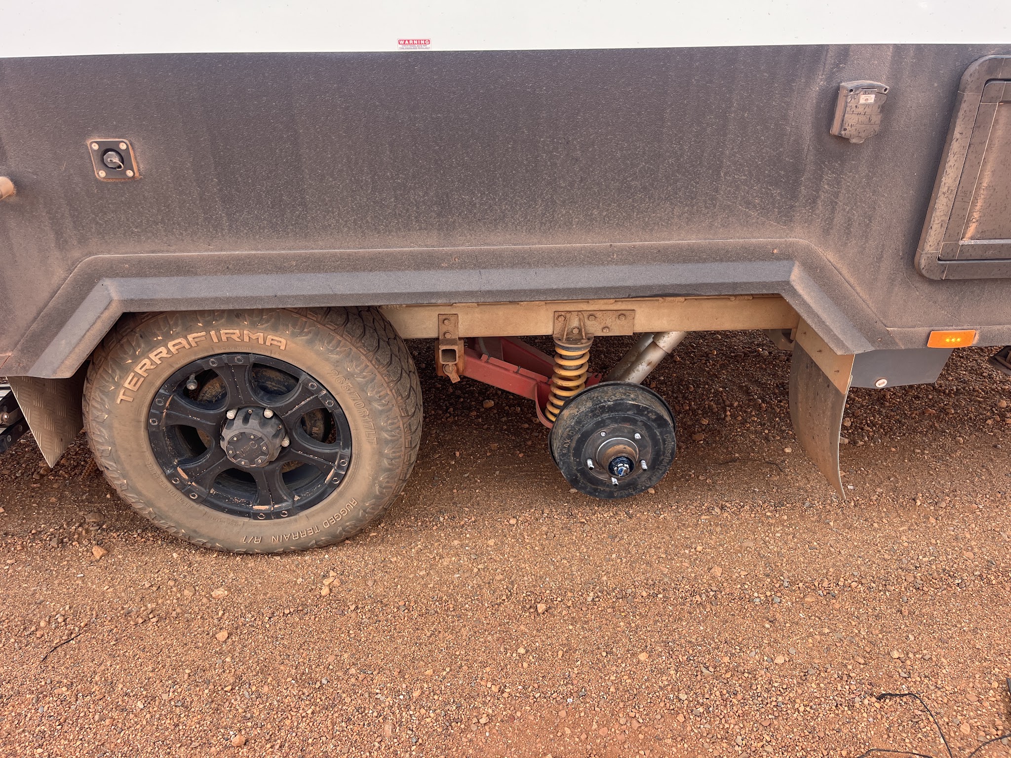 Close up of a trailer suspension and hub assembly after repair